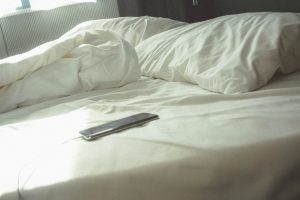 mobile phone on bed